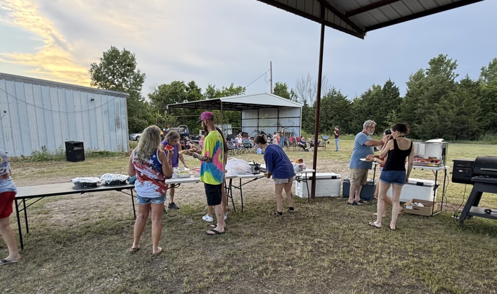 Community members enjoying food and fellowship at the Wetumka Oklahoma 4th of July block party