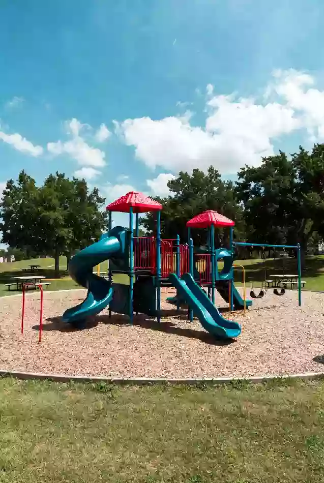 Clean playground in a Sapulpa park on a bright summer day
