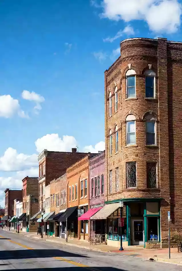 Vertical photo of historic brick buildings along main street in Okmulgee Oklahoma