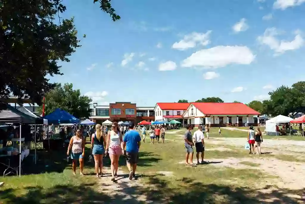 Wide view of a community festival atmosphere with people and open space in Okmulgee Oklahoma