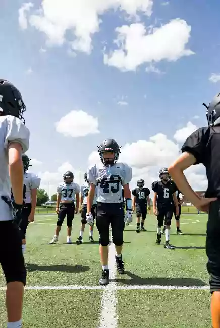 Vertical photo of high school football players practicing on the field in Eufaula Oklahoma