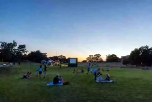Free outdoor community event with families gathered in a Stillwater park