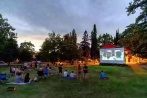 Families gathered for a free outdoor movie night in an Ada park