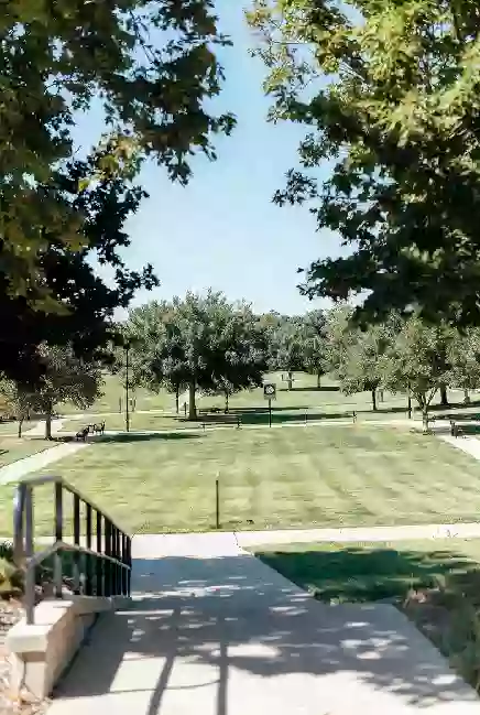 Well-maintained public park with walking paths in Ada