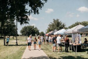Community festival atmosphere with people and open space in a Bixby park