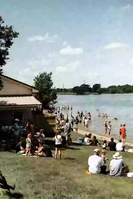Families at a free outdoor community event near the water in El Reno
