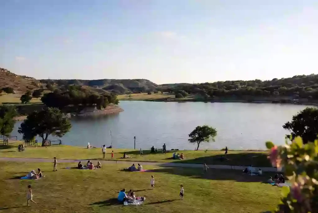 Free outdoor community event with families gathered at a lake park in Ponca City