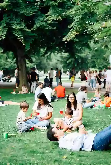 Families at a free outdoor community event or park gathering in Tahlequah