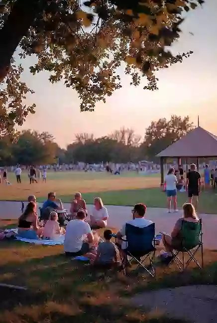 Families at a free outdoor community event in a Chickasha park