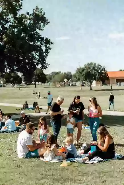 Families at a free outdoor community event in a Duncan park