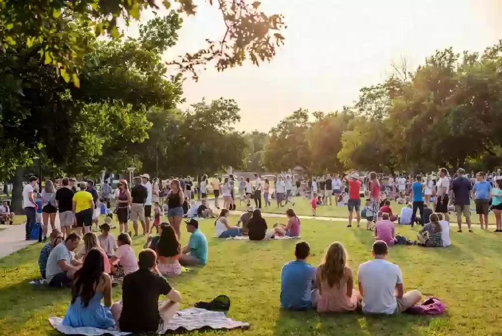 Free outdoor community event with families gathered in a Sand Springs park