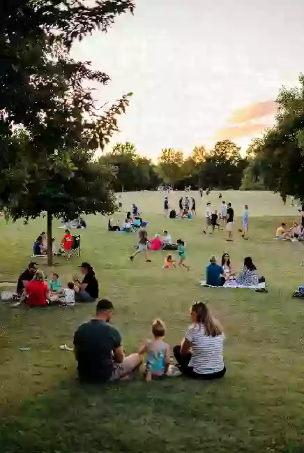 Families at a free outdoor community event in a Sand Springs park