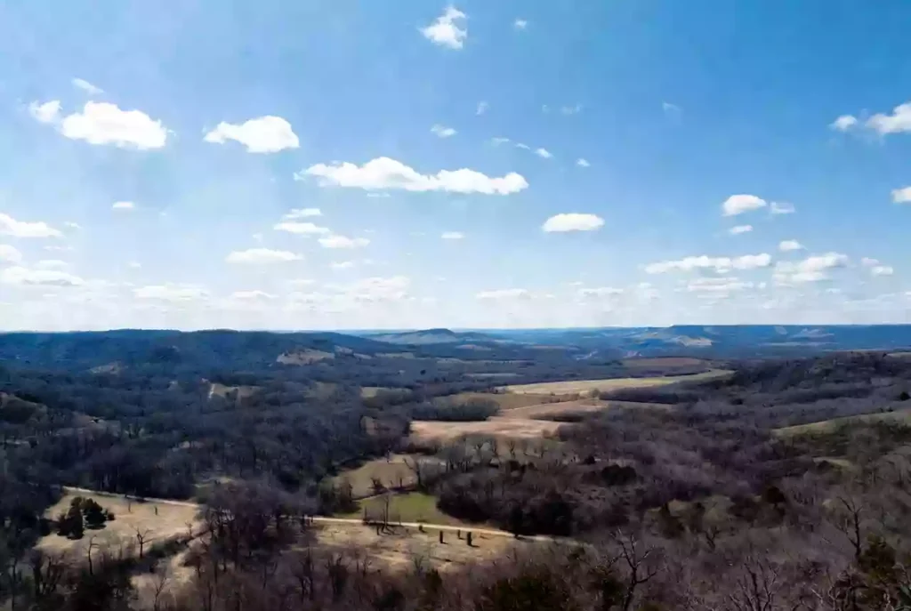Vertical view of rural road and elevated water storage infrastructure in Sequoyah County Oklahoma