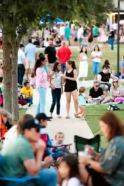 Families at a free outdoor community event or park gathering in Sequoyah County Oklahoma
