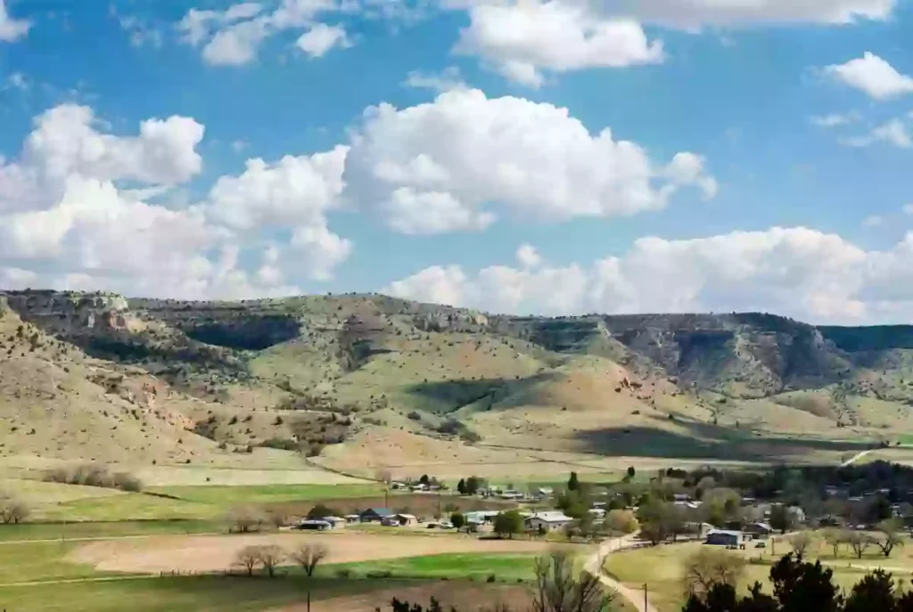 Rural landscape in Seminole County Oklahoma with rolling hills and farmland on a sunny day