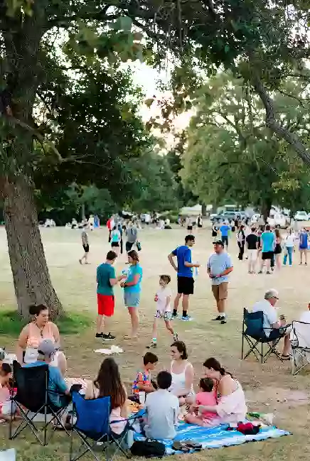 Families at a free outdoor community event or park gathering in McCurtain County Oklahoma