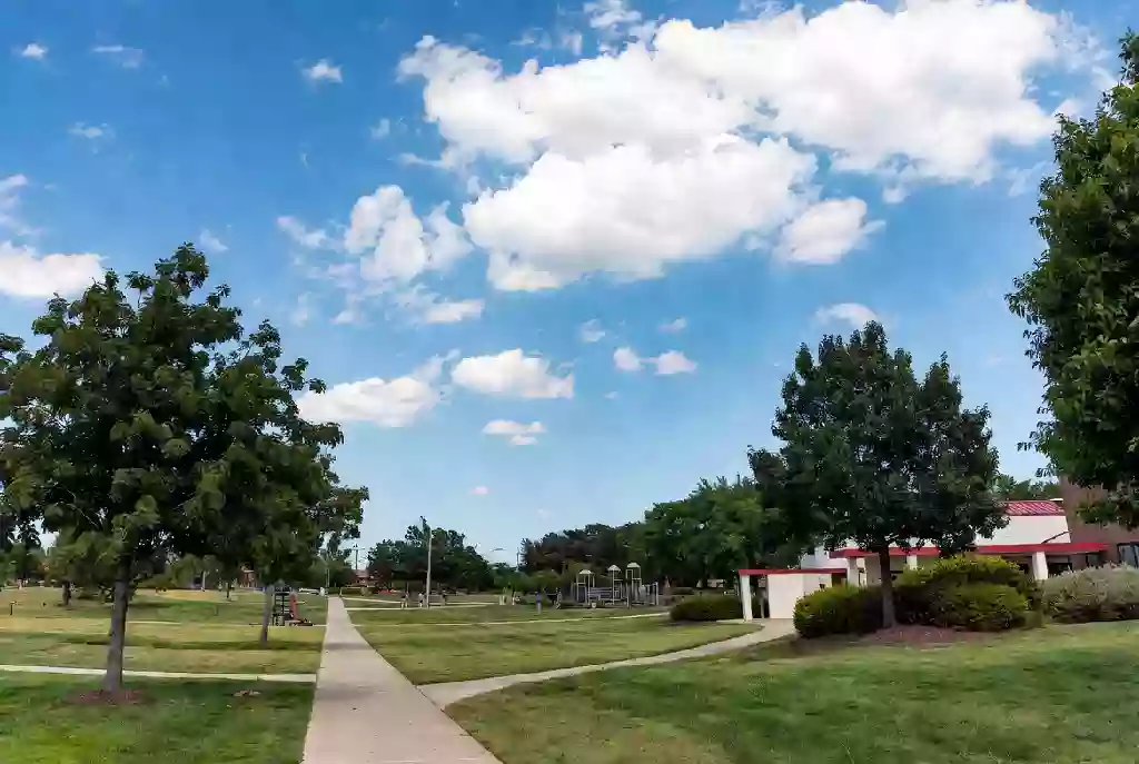 Well-maintained public park with green lawns and walking paths
