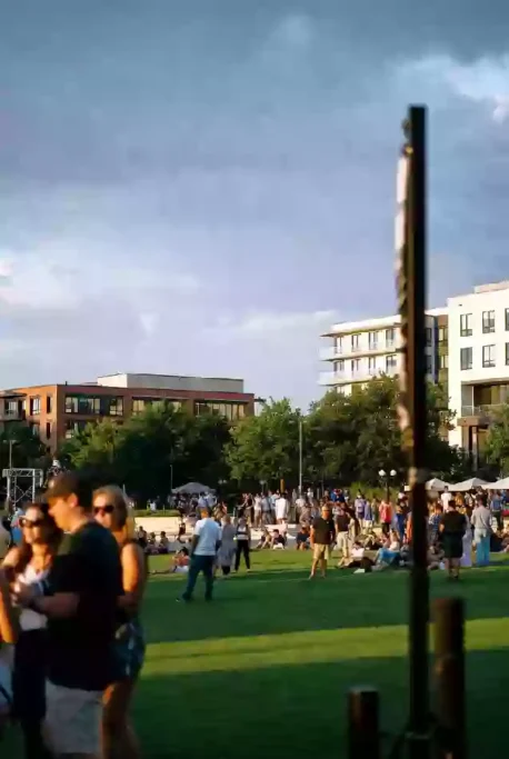 People gathered on the lawn during summer outdoor event