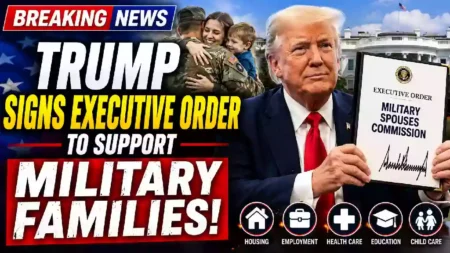 President Donald Trump displays an executive order establishing the Military Spouses Commission as part of a White House initiative supporting military families.